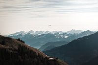 Alpine landscape with the Großglockner massif & a paraglider