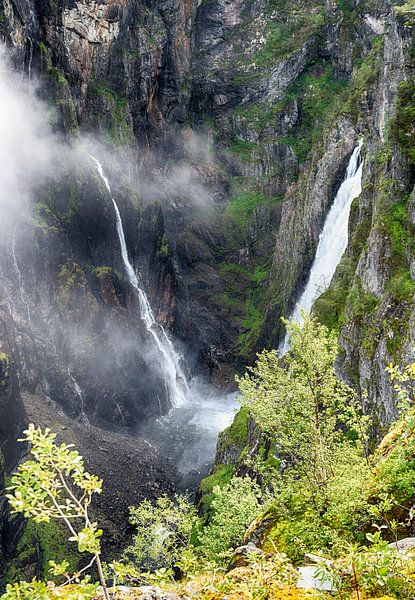 Voringfossen waterfall in norway seen from street level on sunny day by ChrisWillemsen