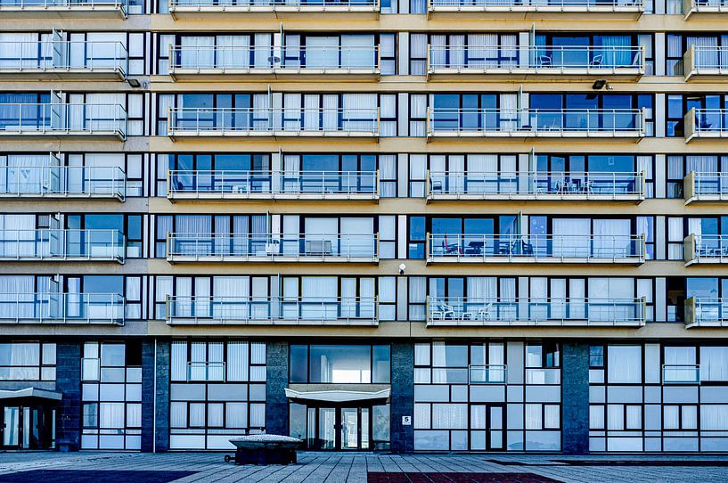 Apartment building with a rhythm of glasswork in Ostend Belgium by george vogelaar