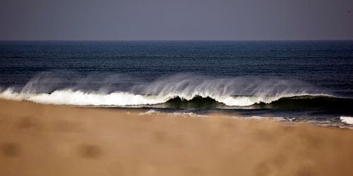 Golven op het strand by schylge foto