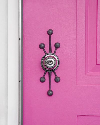 Pink Door with a Mid-Century Modern Handle