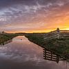 Kleurrijke zonsopkomst boven natuurgebied Kruiszwin in Anna Paulowna van Bram Lubbers