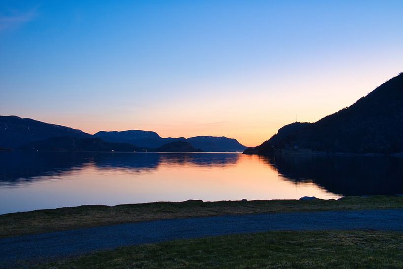 Fjord and sea in Norway at the blue hour by Martin Köbsch