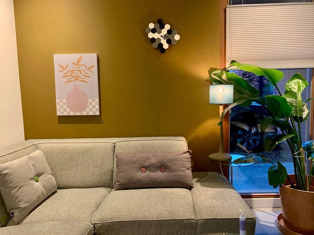 Minimalist retro still live with leaves in a vase. Earthy tints, pink, beige, white and grey blue  by Dina Dankers 