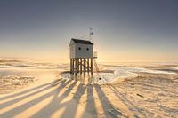 Drenkelingenhuisje Terschelling: Zonsondergang met Opwaaiend Zand in Pastelkleuren