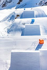 Snowboarder and drone right next to each other in the air by Hidde Hageman