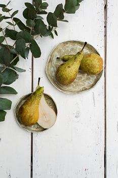 Pear on green pottery