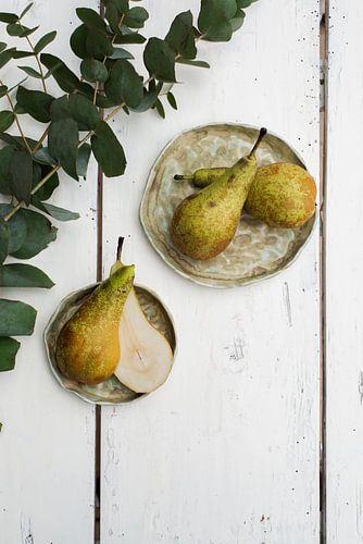 Pear on green pottery