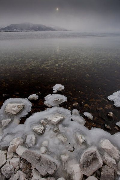 Stones on frozen lake baikal in water by Michael Semenov