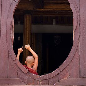 Young munk in oval window by Carolien van den Brink