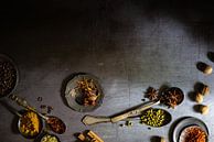 Spices on an old griddle by Saskia Schepers thumbnail