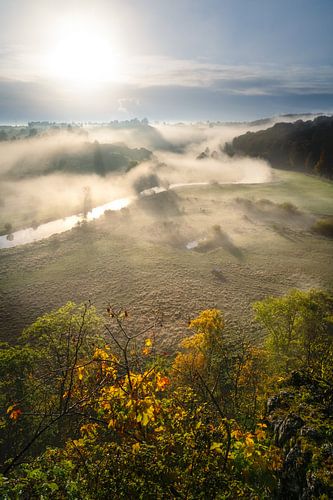 Fog at sunrise in the Eselsburg valley with river Brenz near Heidenheim