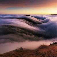 Sunrise with misty mountains