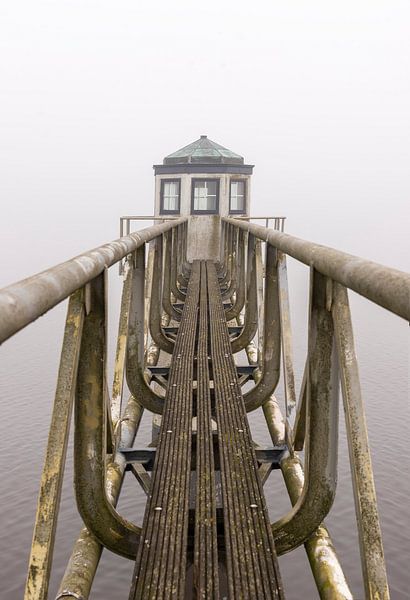 Oostmahorn lighthouse in the fog by Martin van Kammen