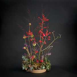 Bright and colourful floral arrangement against dark background by Richard Zeinstra