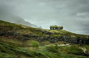 A traditional mountain hut in the rugged landscape of Vestland, Norway