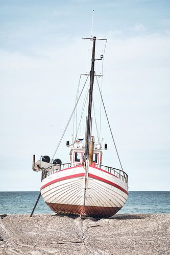 Fishing boat lies on dry land