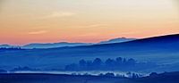 Hills and mountains in blue morning light by Werner Lehmann thumbnail