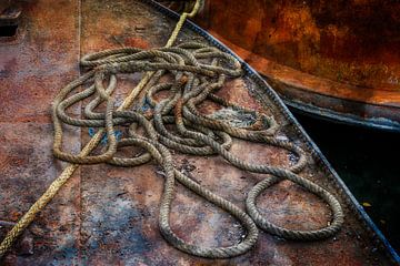 Old rope and rusty boats by Kok and Kok