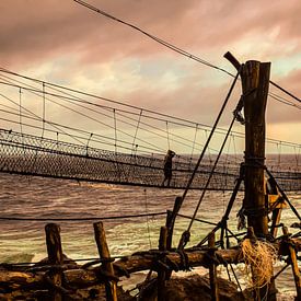 A man on a swinging rope foot bridge. by kall3bu