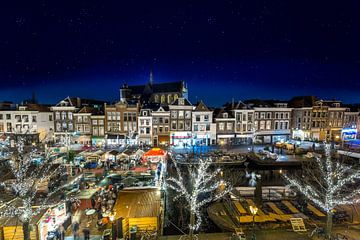 Traditional floating Christmas Market in the old town of Leiden by Ruurd Dankloff