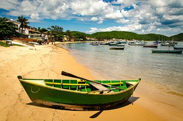Rowing boat on the beach in the bay in front of Buzios on the Costa do sol in Brazil by Dieter Walther