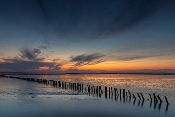 Un beau coucher de soleil au Wad de Ternaard . sur Ytje Veenstra