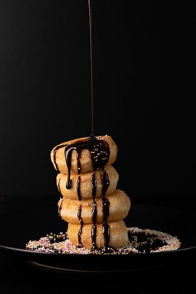 Donuts with chocolate sauce by Gaby Hendriksz