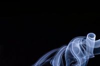 landscape image of blue smoke in the right-below corner