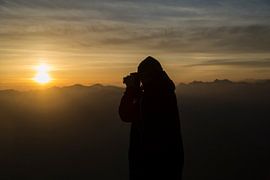 Sunset on a mountain top in the Alps. by Hidde Hageman