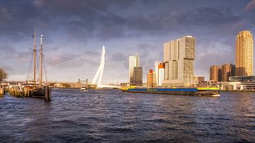 Cityscape city view of Rotterdam during a storm with boats in the foreground.