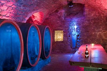 Wine cellar with wooden barrels by Jörg B. Schubert