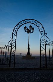 Graceful fence and lantern at dusk