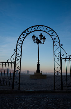 Graceful fence and lantern at dusk
