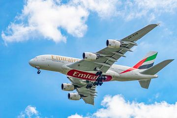 Airplane Airbus A380-800 of Emirates flying in the air by Sjoerd van der Wal