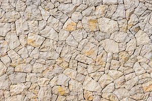 Natural stone wall background structure, close up by Alex Winter