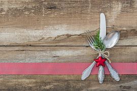 Christmas menu dinner table place setting with cutlery set decoration by Alex Winter