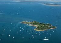 Recreational island Ossehoek in the Grevelingen with boats at anchor on a beautiful summer day