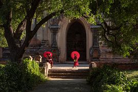 Two monks in front of a temple in Bagan, Myanmar by Anges van der Logt