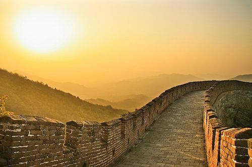 Sunset on the great wall of China, the air is saturated with smog - a red sunset