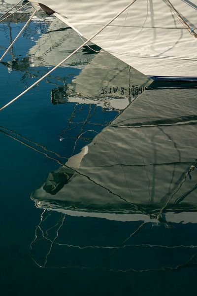 Details of boats and their reflection in the sea water by Adriana Mueller