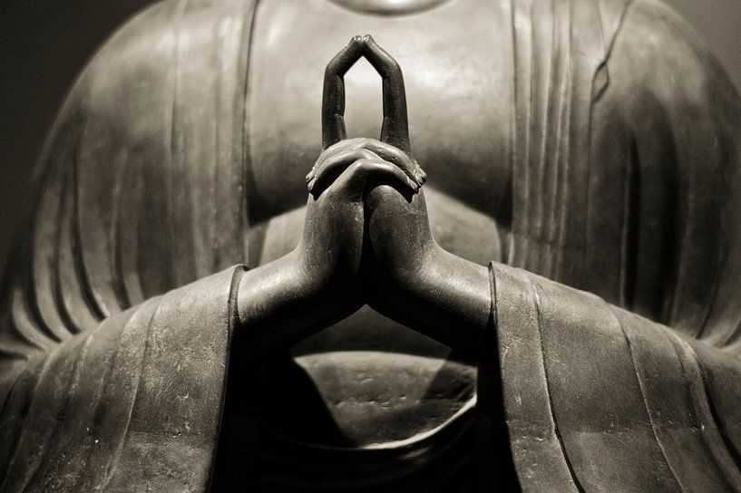 Hands of meditating Buddha statue in sepia by Rob van Keulen