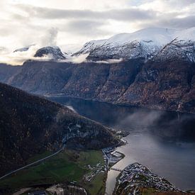 Beautiful fjord in Norway with white snowy peaks by Geke Woudstra