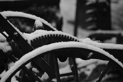 snow-covered antique machine
