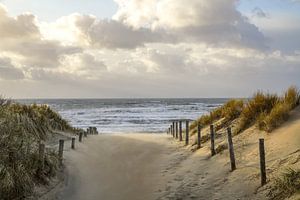 Beach, sea and sun on a stormy evening! by Dirk van Egmond