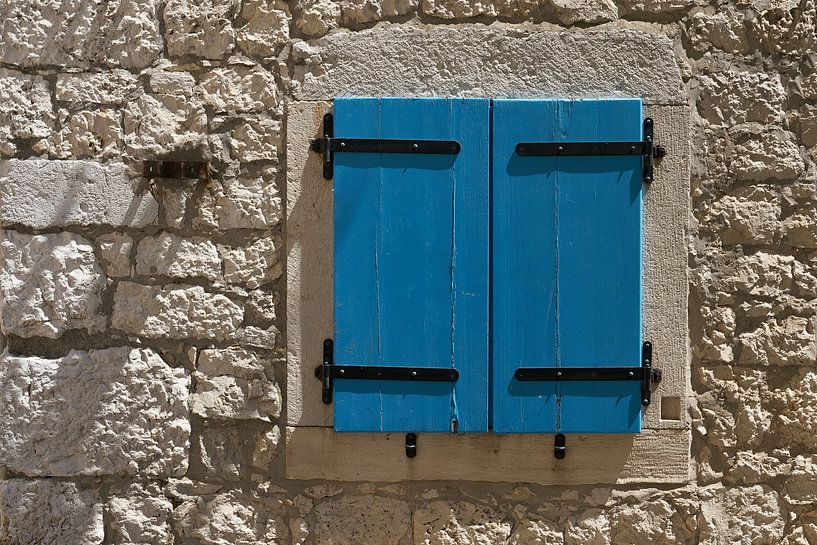 Locked shutters in the old town centre by Heiko Kueverling