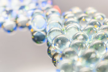 Clear glass globe cluster - light reflections in focus