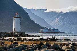 Hurtigruten passes the Høgstein lighthouse before entering the fjords, Godøy, Norway by qtx