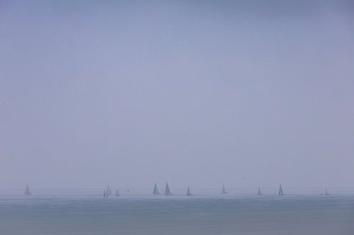 Sailing boats in the morning mist