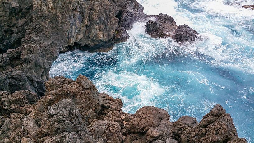 Rocky coast of Madeira with roaring surf by Hans-Heinrich Runge